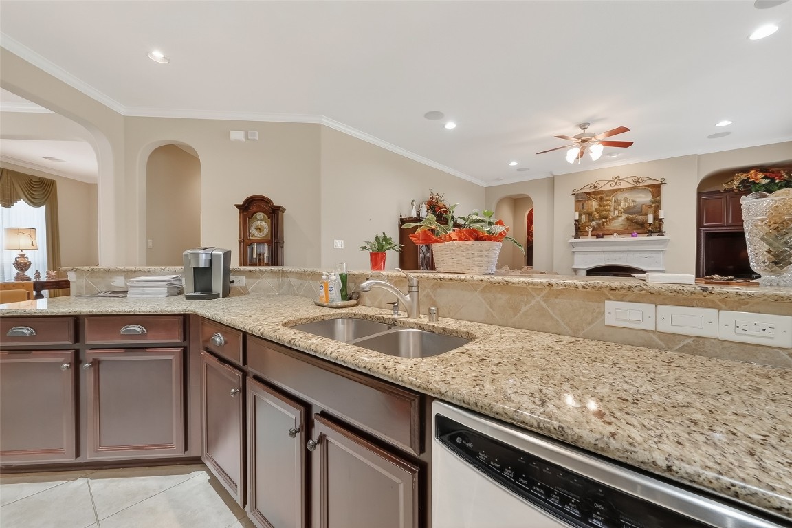 18622 Yorkshire Manor Court Spring, TX 77379 - Photo 21 of 41 a kitchen with granite countertop a sink and a wooden floor