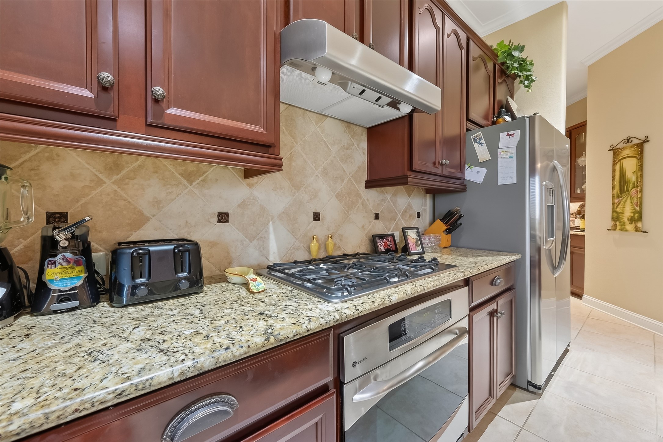 18622 Yorkshire Manor Court Spring, TX 77379 - Photo 26 of 49 a kitchen with stainless steel appliances granite countertop a sink stove and cabinets