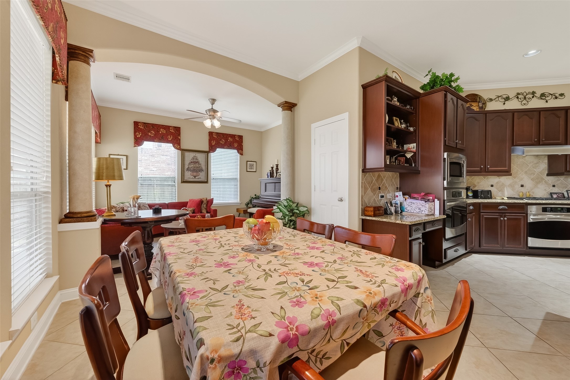 18622 Yorkshire Manor Court Spring, TX 77379 - Photo 31 of 49 a large kitchen with a table chairs refrigerator and cabinets