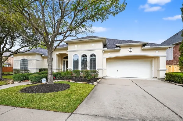 a front view of a house with outdoor space