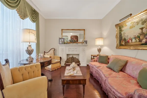 a view of a dining room with furniture and a chandelier
