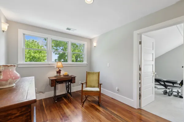 a bedroom with a bed and dresser