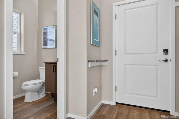 a white toilet sitting next to a bathroom sink