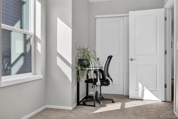 a view of hall way with furniture