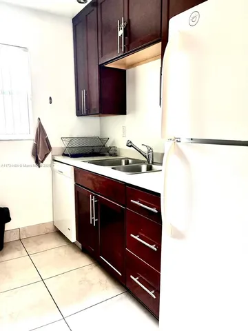 a view of a chairs and table in a patio