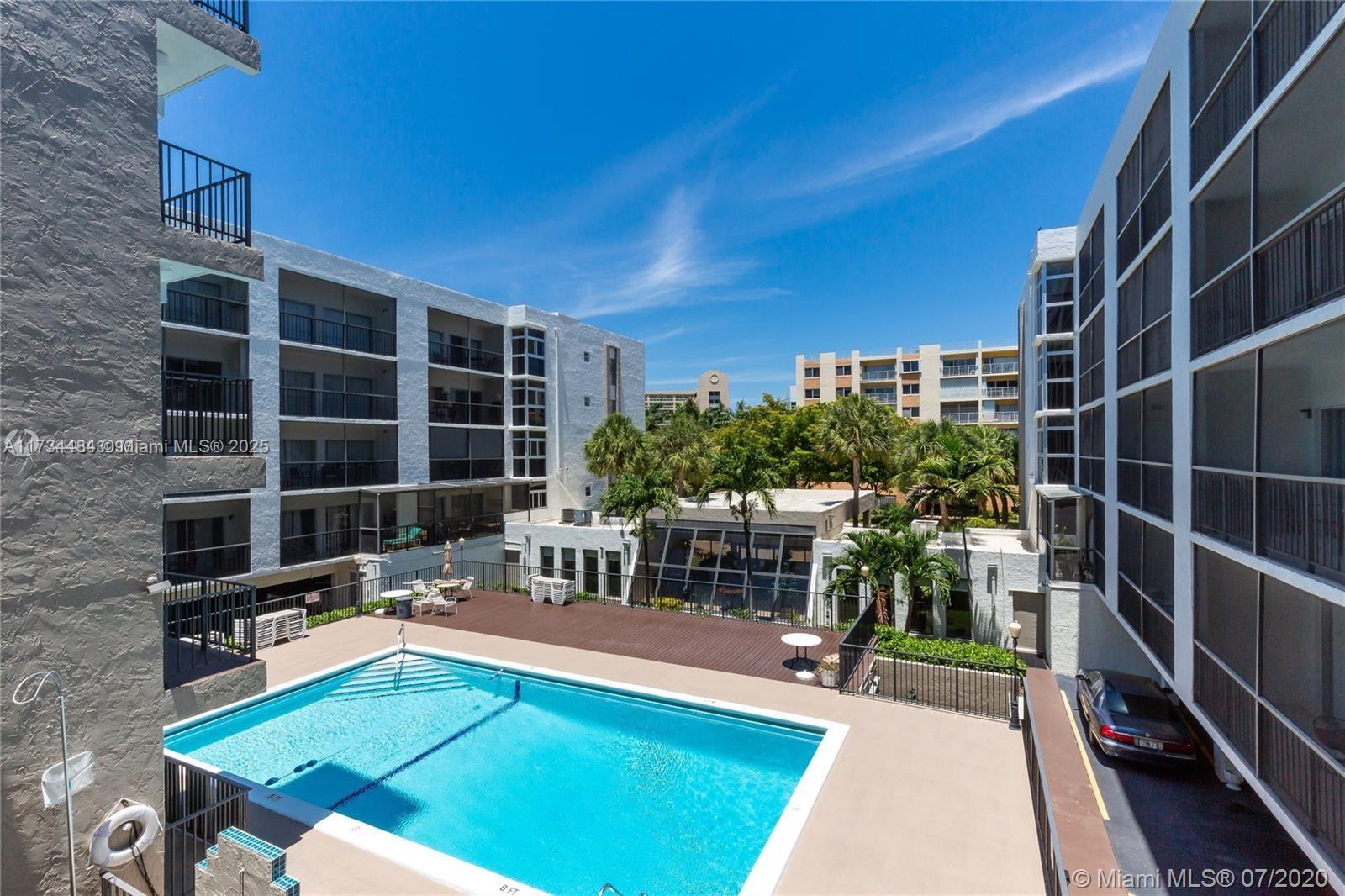 201 178th Drive, Unit 331 Sunny Isles Beach, FL 33160 - Photo 13 of 27 a view of a chairs and table in a patio