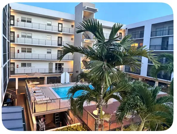 a bathroom with a sink toilet mirror and vanity