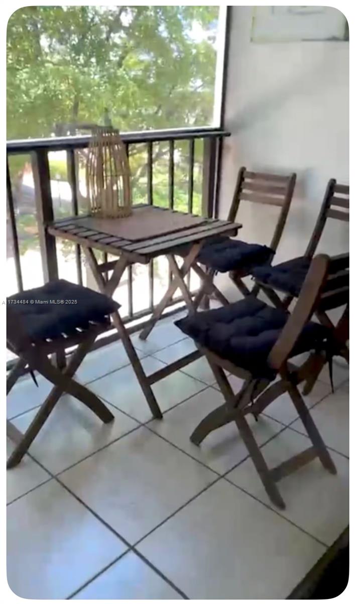 201 178th Drive, Unit 331 Sunny Isles Beach, FL 33160 - Photo 17 of 27 a view of a balcony with chairs