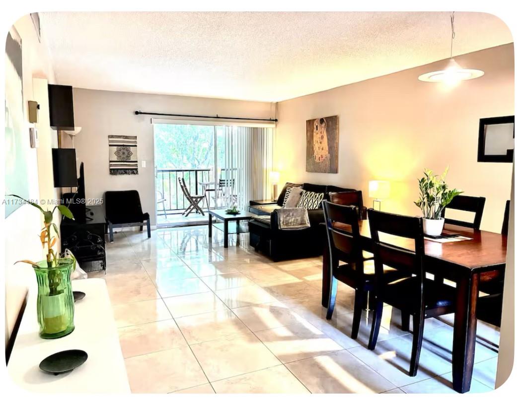 201 178th Drive, Unit 331 Sunny Isles Beach, FL 33160 - Photo 20 of 27 a view of a dining room with furniture