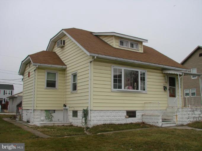 3002 Ritchie Avenue Sparrows Point, MD 21219 - Photo 2 of 15 a front view of a house with a yard