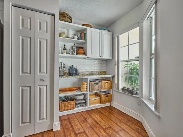 a bedroom with a bed and ceiling fan