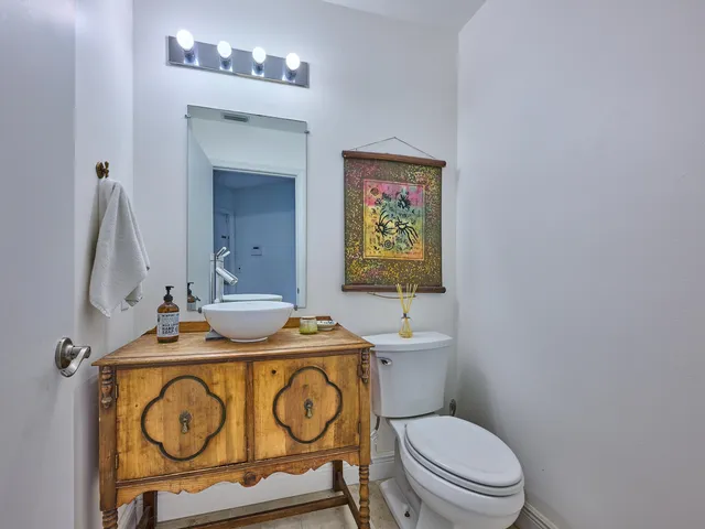 a view of kitchen with cabinets and wooden floor