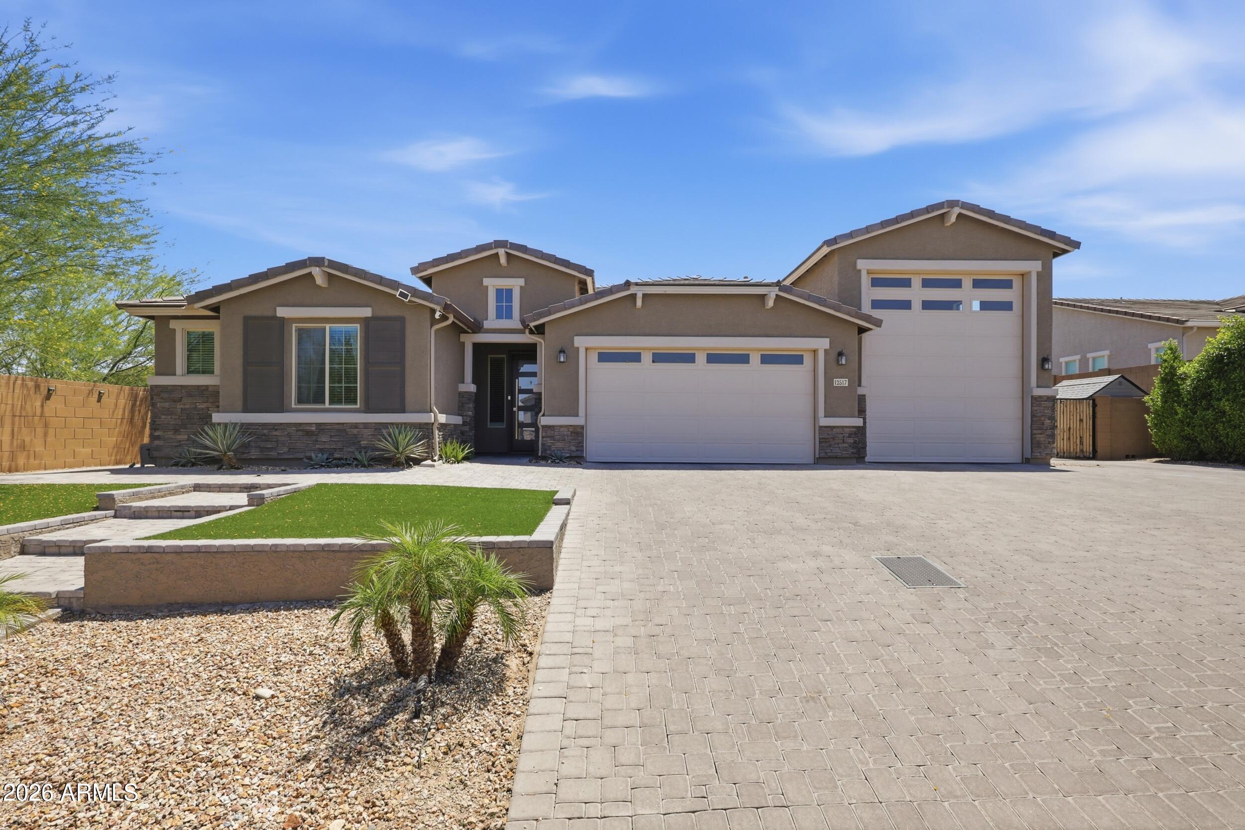 12517 West Lawrence Road Glendale, AZ 85307 - Photo 1 of 52 a front view of a house with a yard