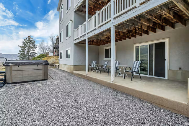11789 Nicklaus Road Sandy, UT 84092 - Photo 47 of 58 Patio / terrace with a patio and a hot tub