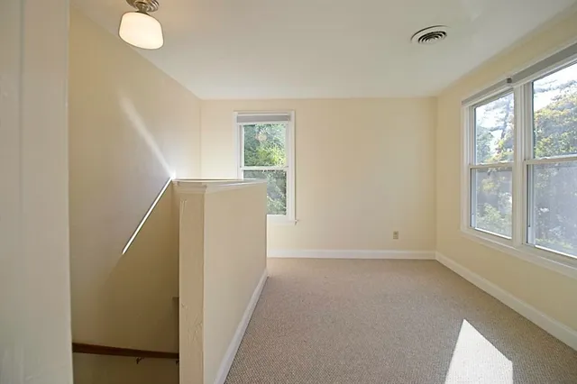 a view of a room with windows