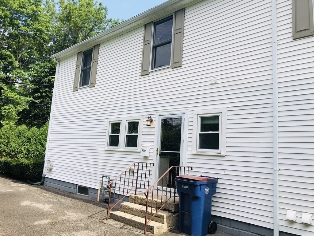 40 Quincy Street, Unit B Sharon, MA 02067 - Photo 9 of 10 a view of a house with a door and a yard
