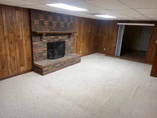 an empty room with a fireplace