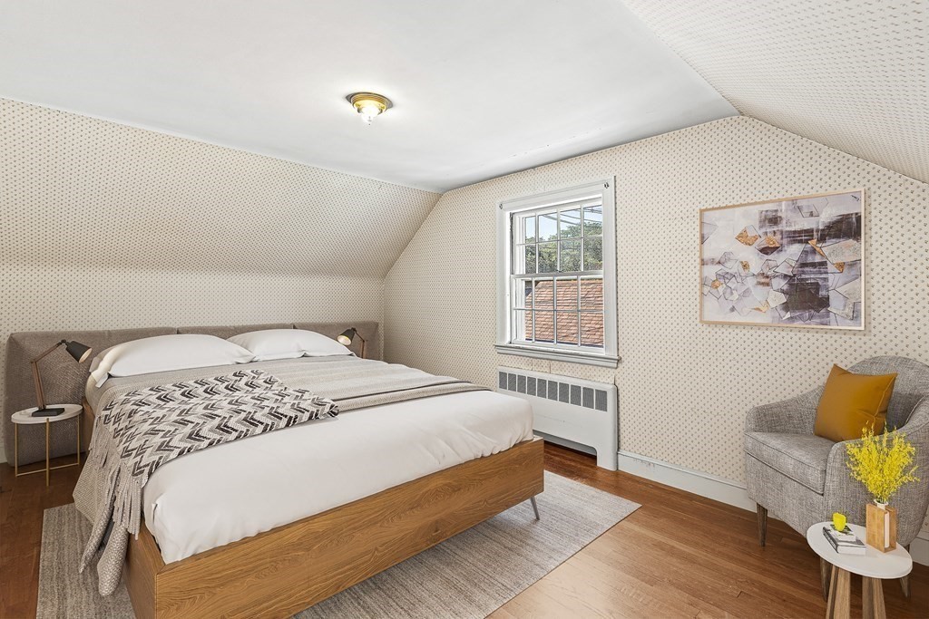 7 Spring Street Lexington, MA 02421 - Photo 15 of 25 a bedroom with a bed and wooden floor