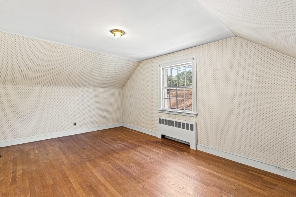 7 Spring Street Lexington, MA 02421 - Photo 16 of 25 an empty room with wooden floor and windows