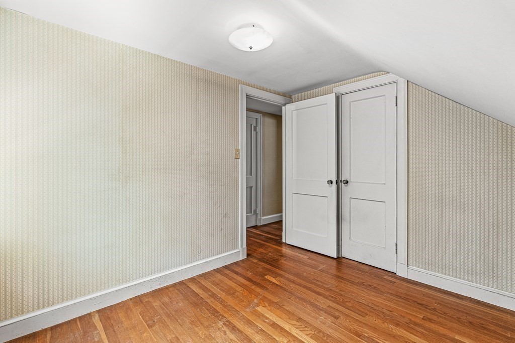 7 Spring Street Lexington, MA 02421 - Photo 17 of 25 a view of an empty room with wooden floor