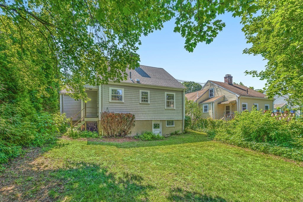 7 Spring Street Lexington, MA 02421 - Photo 22 of 25 a view of a house with backyard and garden