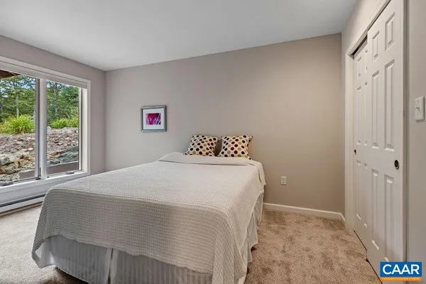 a bedroom with a bed and a closet