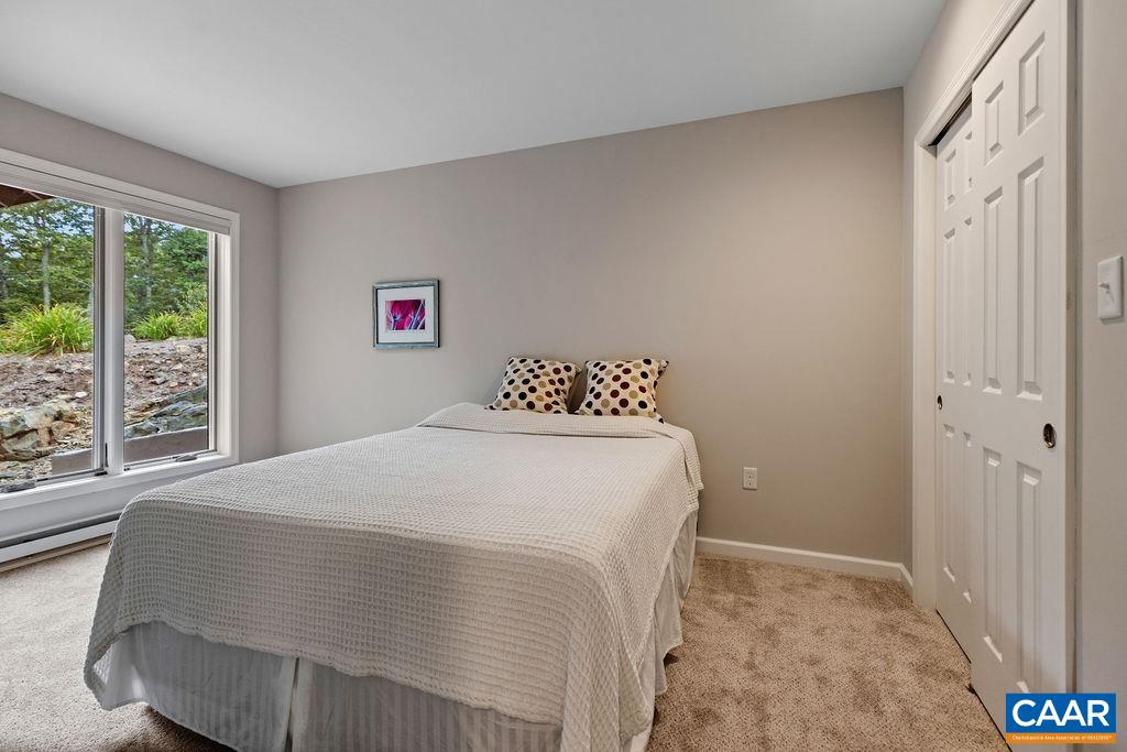 3234 North Ridge Roseland, VA 22967 - Photo 15 of 32 a bedroom with a bed and a large window