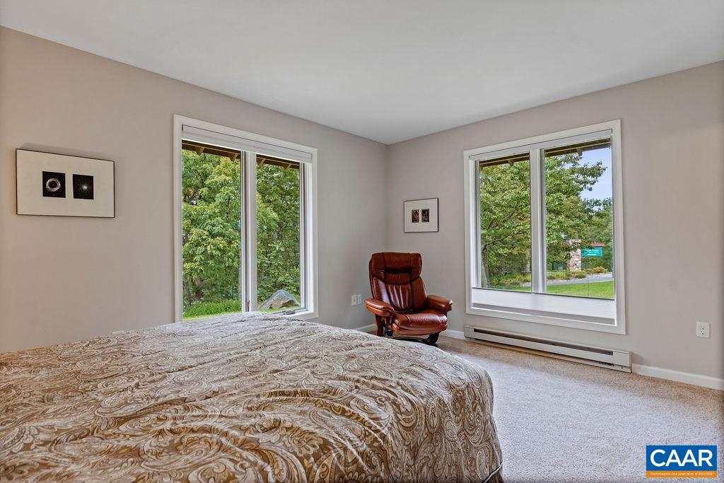 3234 North Ridge Roseland, VA 22967 - Photo 23 of 32 a bed sitting in a bedroom next to a window