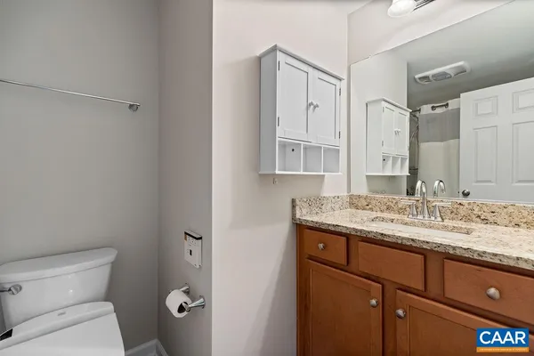 a bathroom with a shower and a toilet