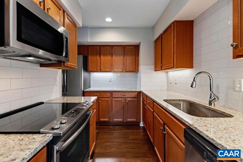 3234 North Ridge Roseland, VA 22967 - Photo 10 of 32 a kitchen with stainless steel appliances granite countertop a sink and a stove top oven