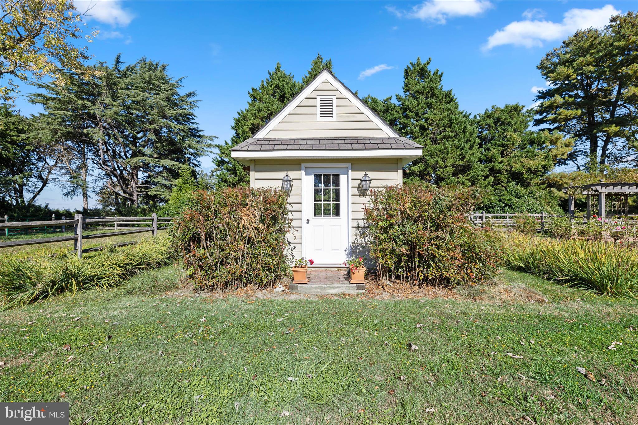 27473 Westpoint Road Easton, MD 21601 - Photo 55 of 58 a front view of a house with a yard