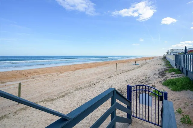 a view of a swimming pool with a lounge chairs