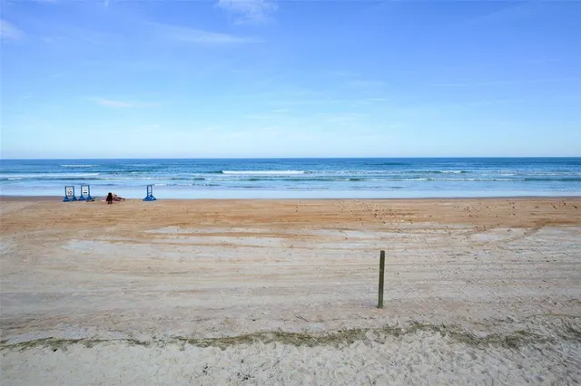 a view of a swimming pool with a roof deck