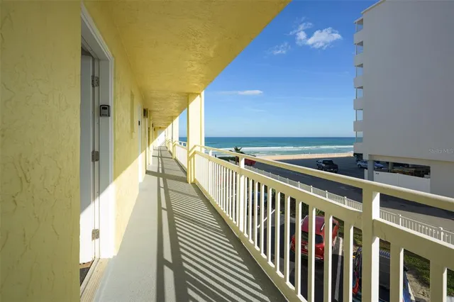 a kitchen with a refrigerator and cabinets
