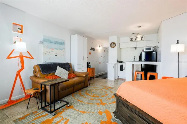 a bed room with a bed and a television