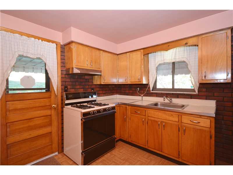 5180 Curry Road Baldwin, PA 15236 - Photo 13 of 21 Kitchen. Door to back covered patio for ease of outdoor living. Stove and Fridge stay!