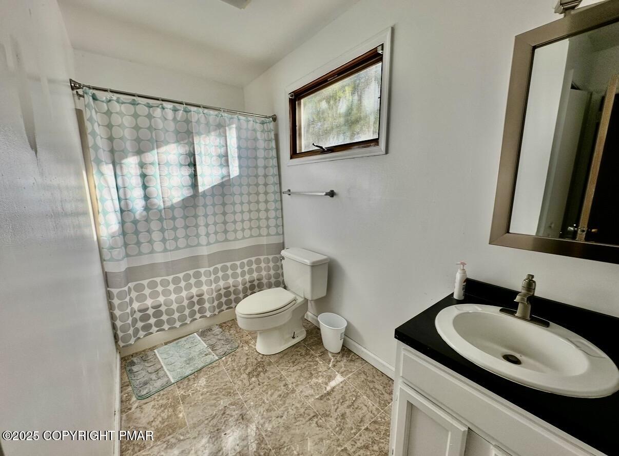 3580 High Crest Road Canadensis, PA 18325 - Photo 11 of 17 a bathroom with a sink toilet and shower