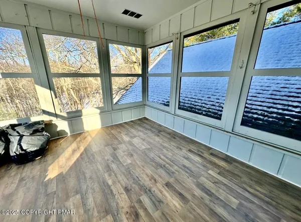 a room with a bed and a window