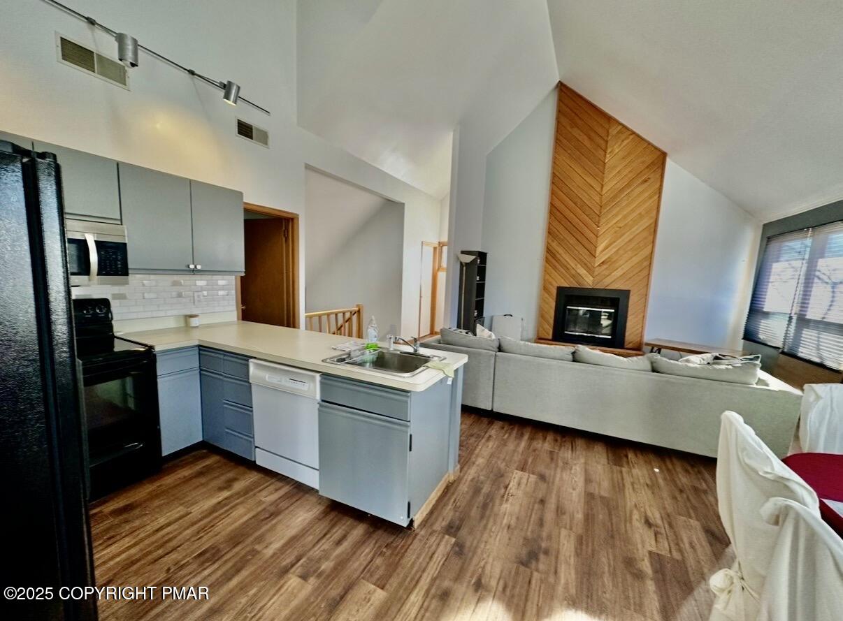 3580 High Crest Road Canadensis, PA 18325 - Photo 5 of 17 a large kitchen with kitchen island granite countertop a sink counter space and stainless steel appliances