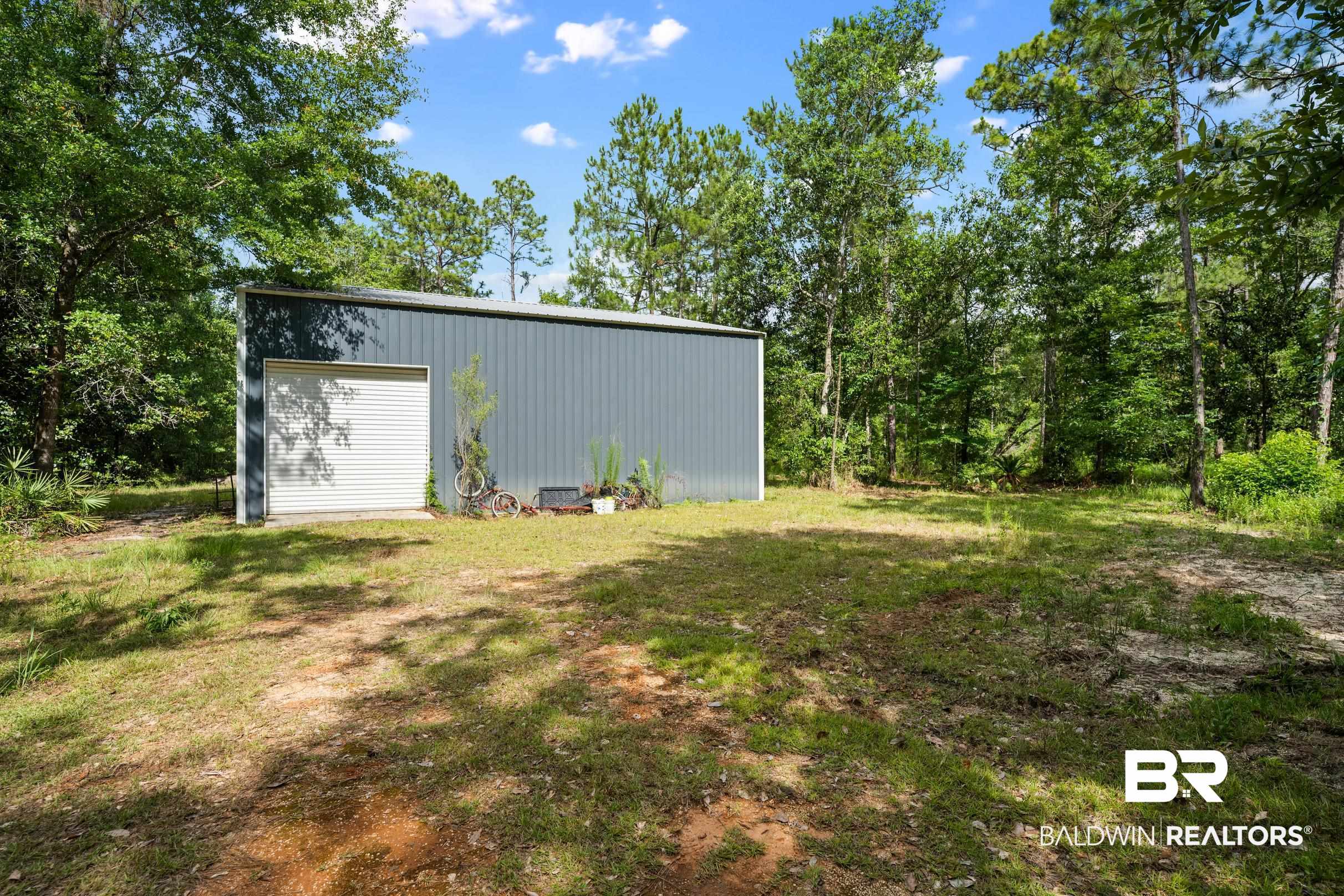 0 Eckman Road Elberta, AL 36530 - Photo 14 of 18 View of yard with an outbuilding and a garage