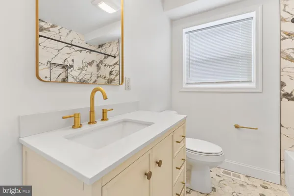 a bathroom with a sink and a toilet