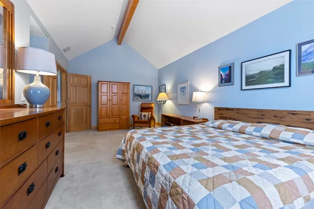 a view of walk in closet with clothes