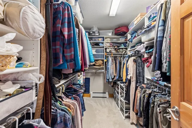 a bathroom with a granite countertop sink and a bathtub