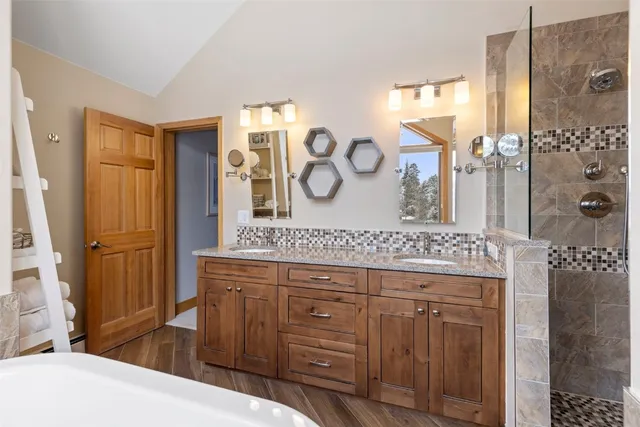 a living room with furniture a flat screen tv and a window