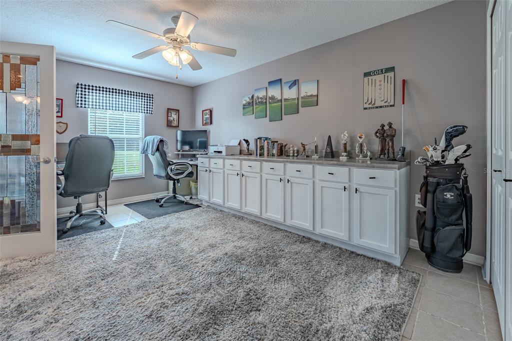 15143 Southwest 14th Avenue Road Ocala, FL 34473 - Photo 31 of 53 a view of a workspace with furniture and a livingroom
