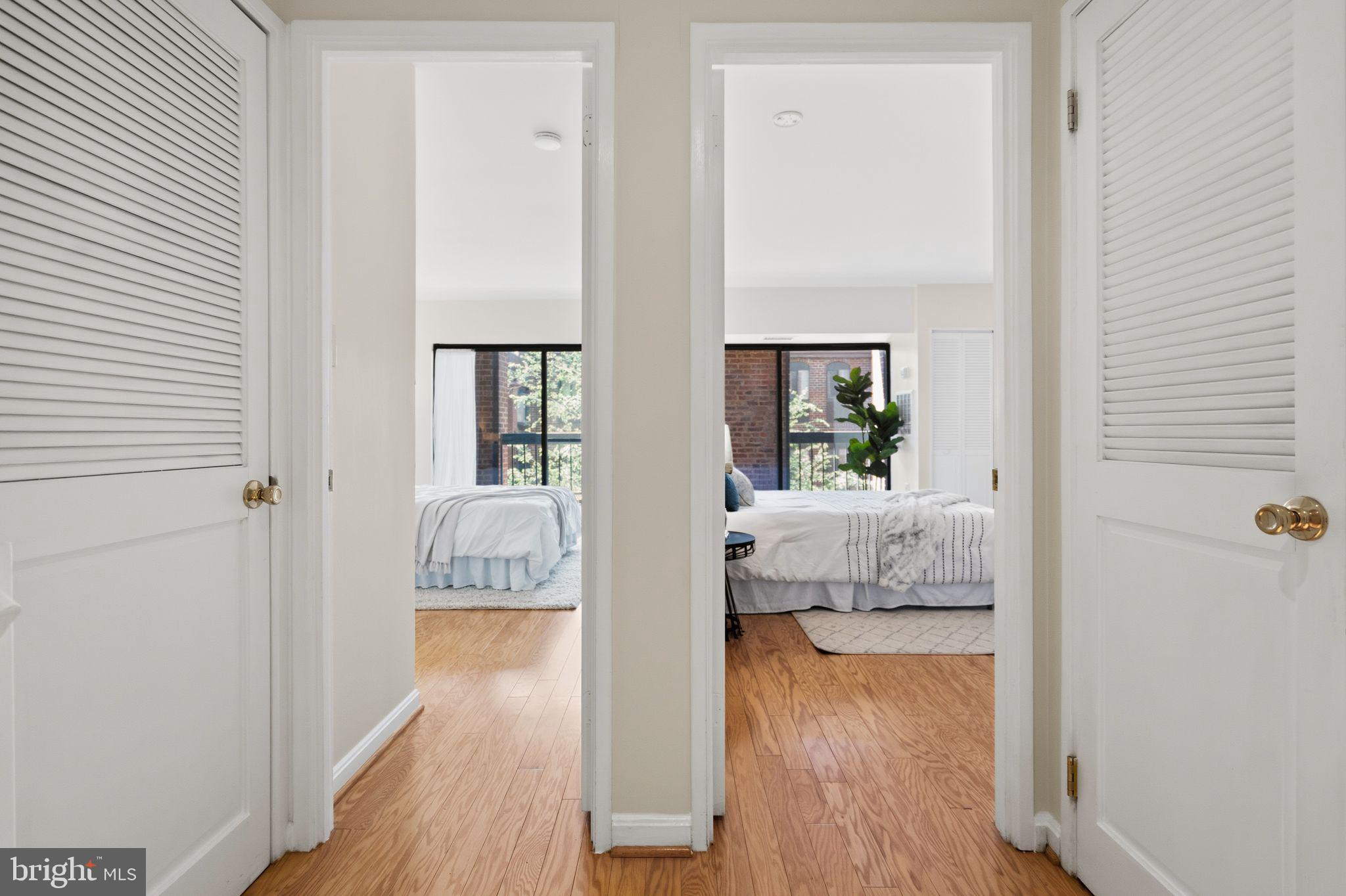 3225 Grace Street Northwest, Unit 226 Washington, DC 20007 - Photo 18 of 45 a view of a bedroom from a hallway
