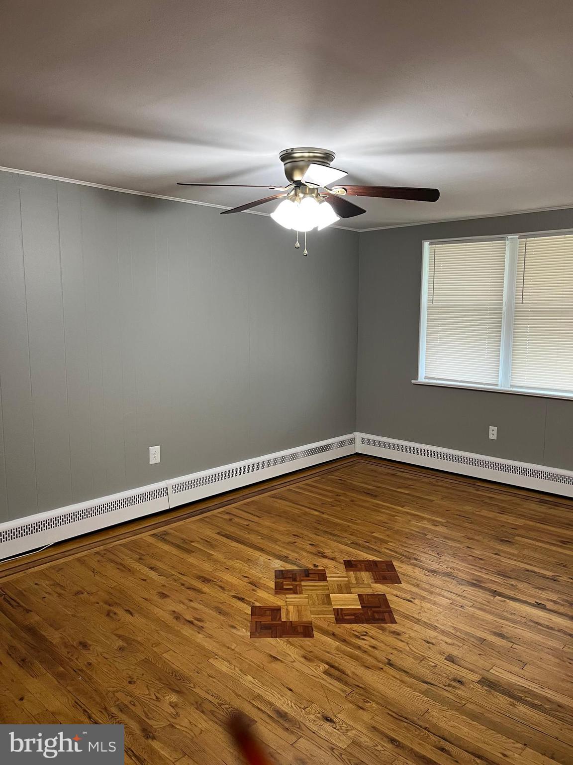 4329 Dungan Street Philadelphia, PA 19124 - Photo 12 of 13 a view of a room with wooden floor and cabinet