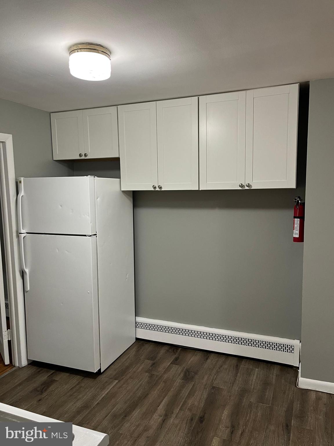 4329 Dungan Street Philadelphia, PA 19124 - Photo 5 of 13 a view of cabinets and wooden floor