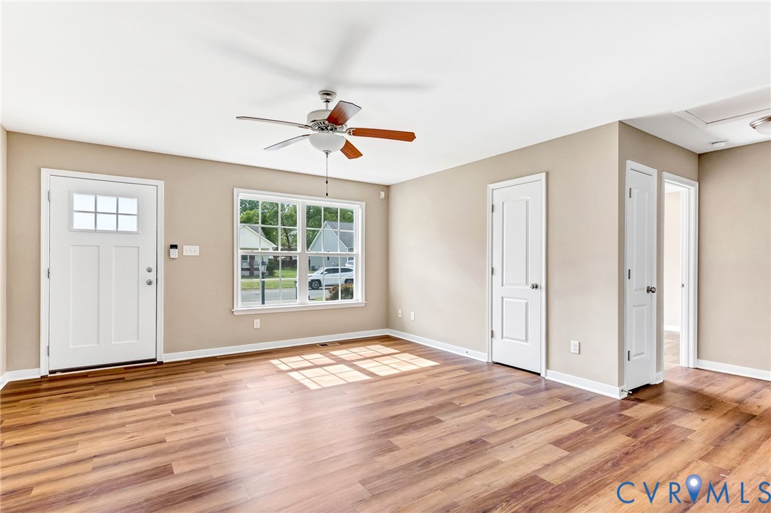 9925 Reymet Court Richmond, VA 23237 - Photo 4 of 30 a view of an empty room with window and wooden floor