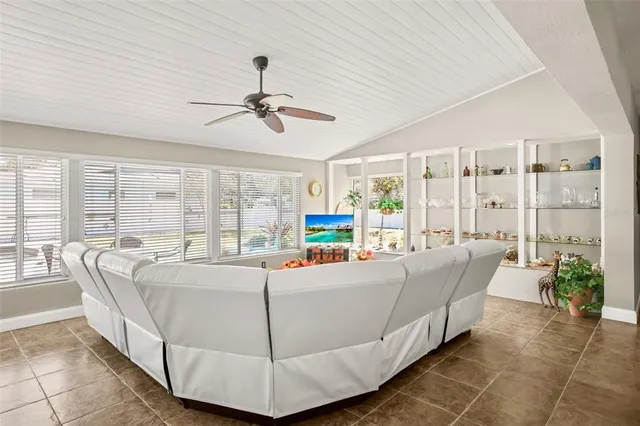a bathroom with a granite countertop toilet and a sink